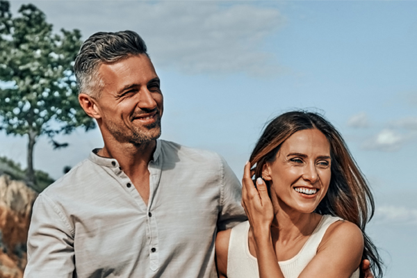 A healthy, happy middle-aged couple under the sky. Get Alpha Lipoic Acid IV Therapy from Balanced Medical Solutions in San Francisco Bay Area.