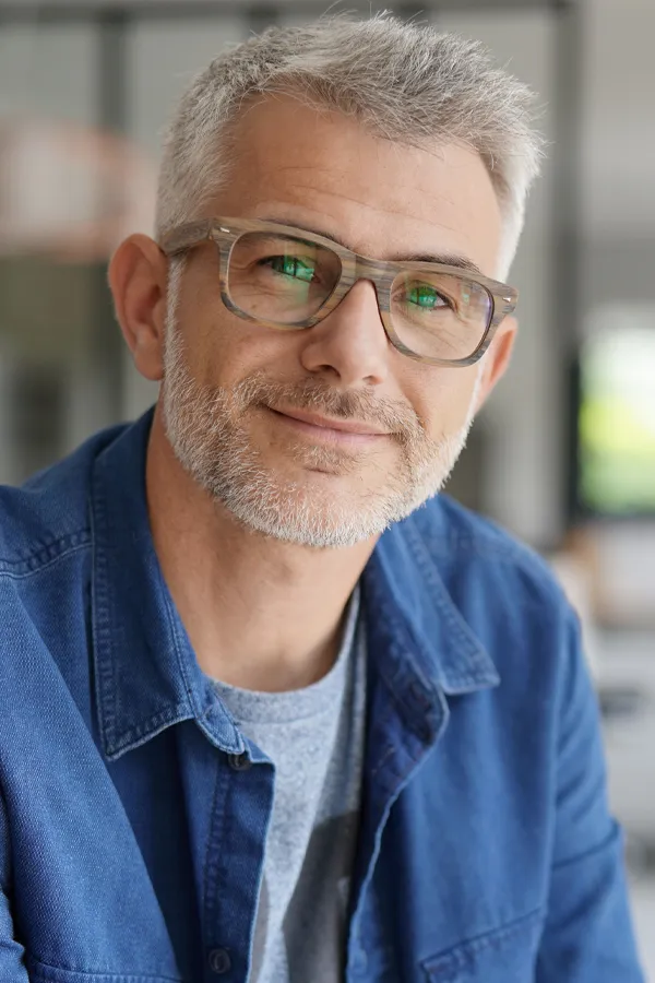A mature man with full gray hair and smooth skin. Get GHK-Cu peptides for skin and hair from Balanced Medical Solutions in San Francisco Bay Area.