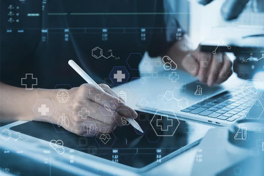 Close-up of a medical professional using a laptop and tablet, with illustrated medical symbols overlayed on the image, symbolizing health conditions treated by Balanced Medical Solutions in San Francisco Bay Area.