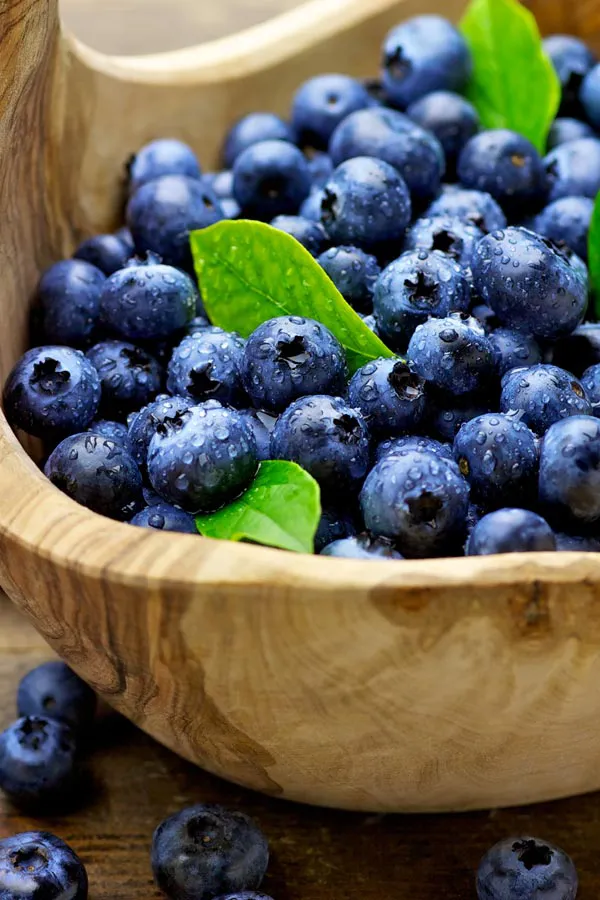 A bowl of refreshing, nourishing blueberries in a wooden bowl, representing IV therapy from Balanced Medical Solutions in San Francisco Bay Area.
