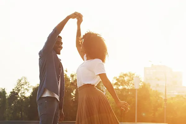 Immunotherapy-Clinic A black couple dancing outside in the sunset. Get immune support treatment from Balanced Medical Solutions in San Francisco Bay Area.